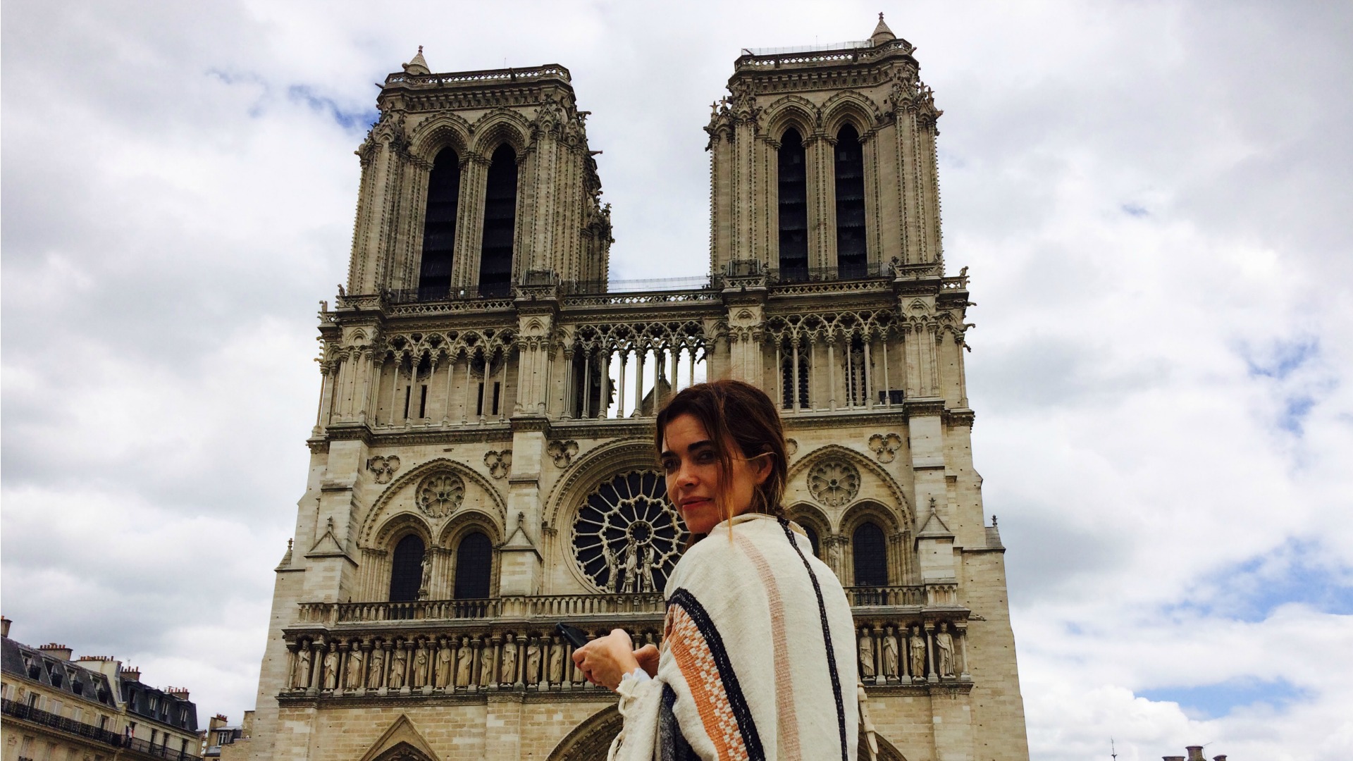 Amelia Heinle (Victoria Newman) struck a pose outside the Notre Dame in Paris.