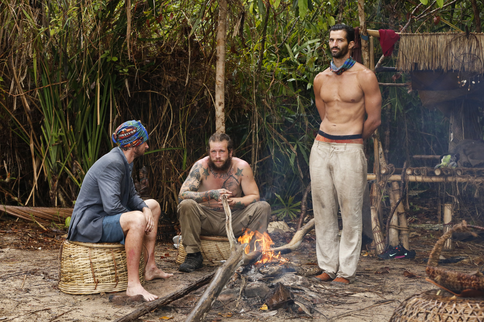 Neal, Jason, and Nick keep warm by their tribe's fire.
