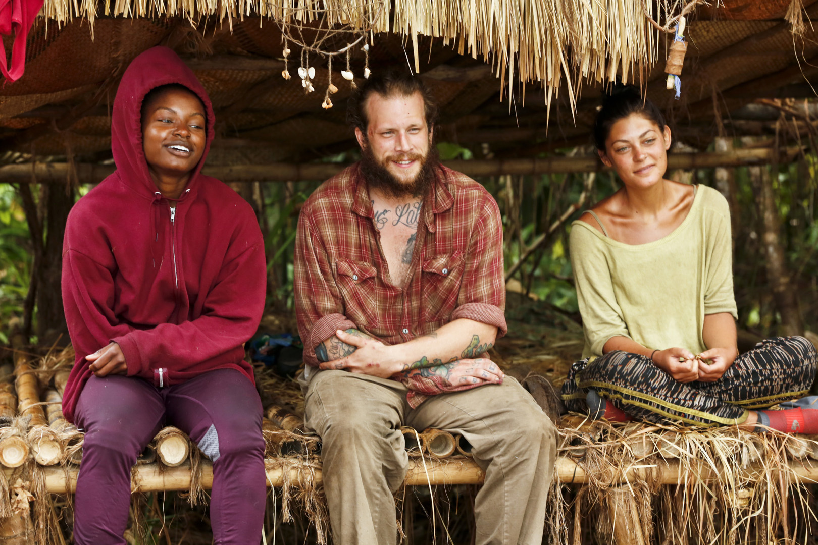 Cydney, Jason, and Michele hang out together under their makeshift shelter.