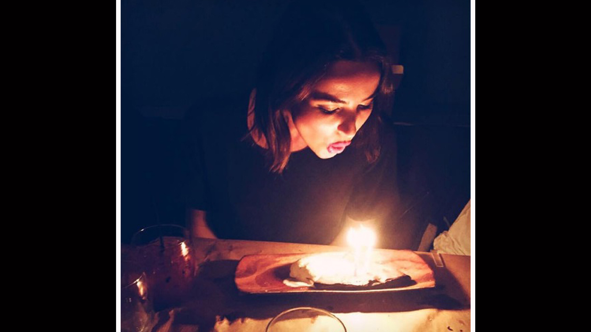 Make a wish! Ashleigh Brewer blows out the candles of her birthday cake.