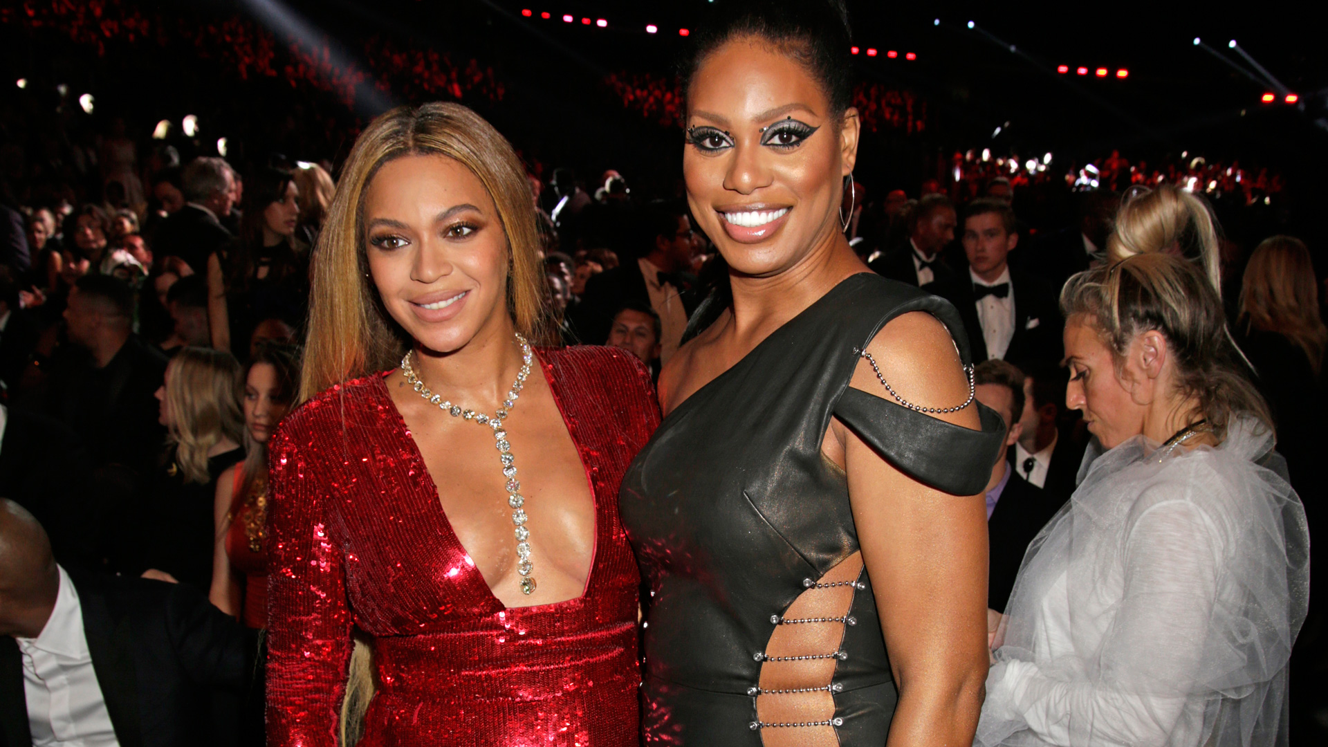 Beyoncé and actress Laverne Cox reveal lots of skin while posing together during a GRAMMY commercial break.