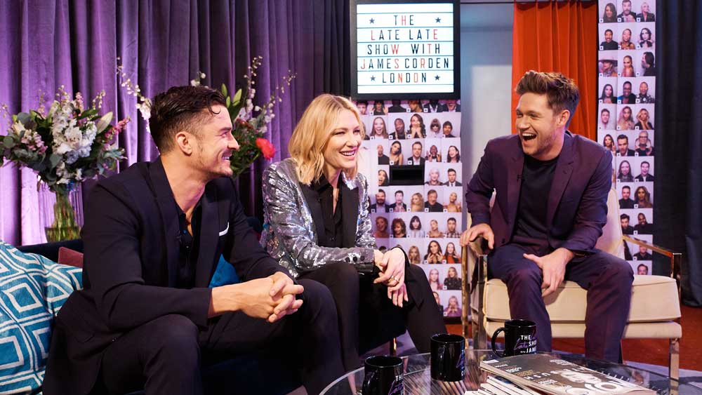 Orlando Bloom, Cate Blanchett, and Niall Horan chill by the photo booth.