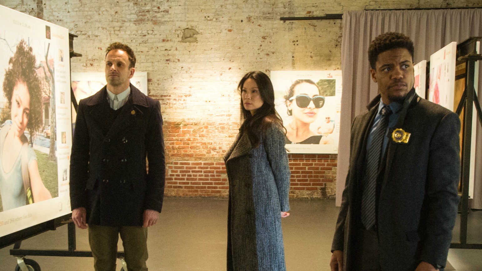 Jonny Lee Miller as Sherlock Holmes, Lucy Liu as Dr. Joan Watson, and Jon Michael Hill as Det. Marcus Bell