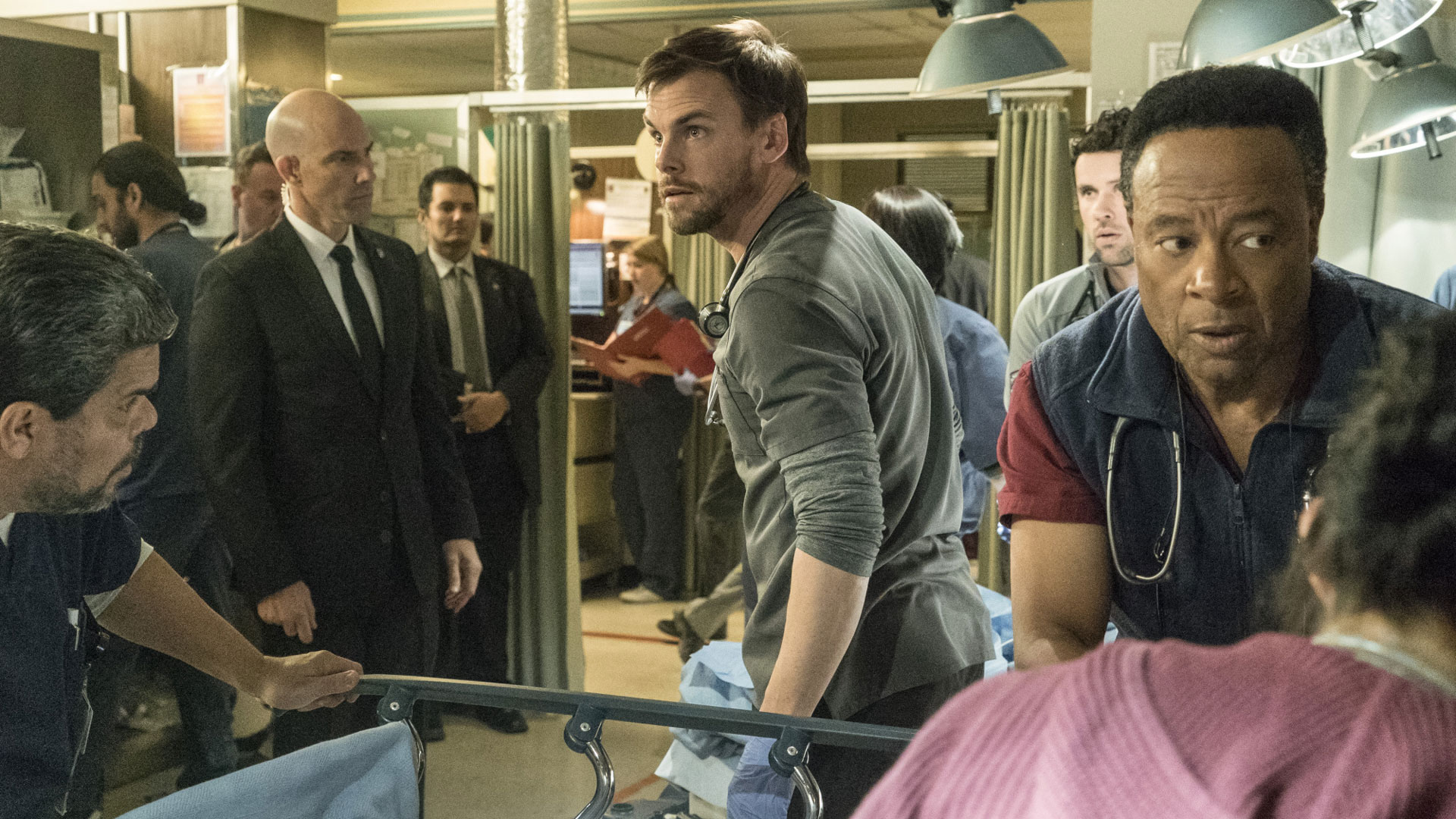 Luis Guzmán as Jesse Sallander, Tommy Dewey as Dr. Mike Leighton, and William Allen Young as Dr. Rollie Guthrie
