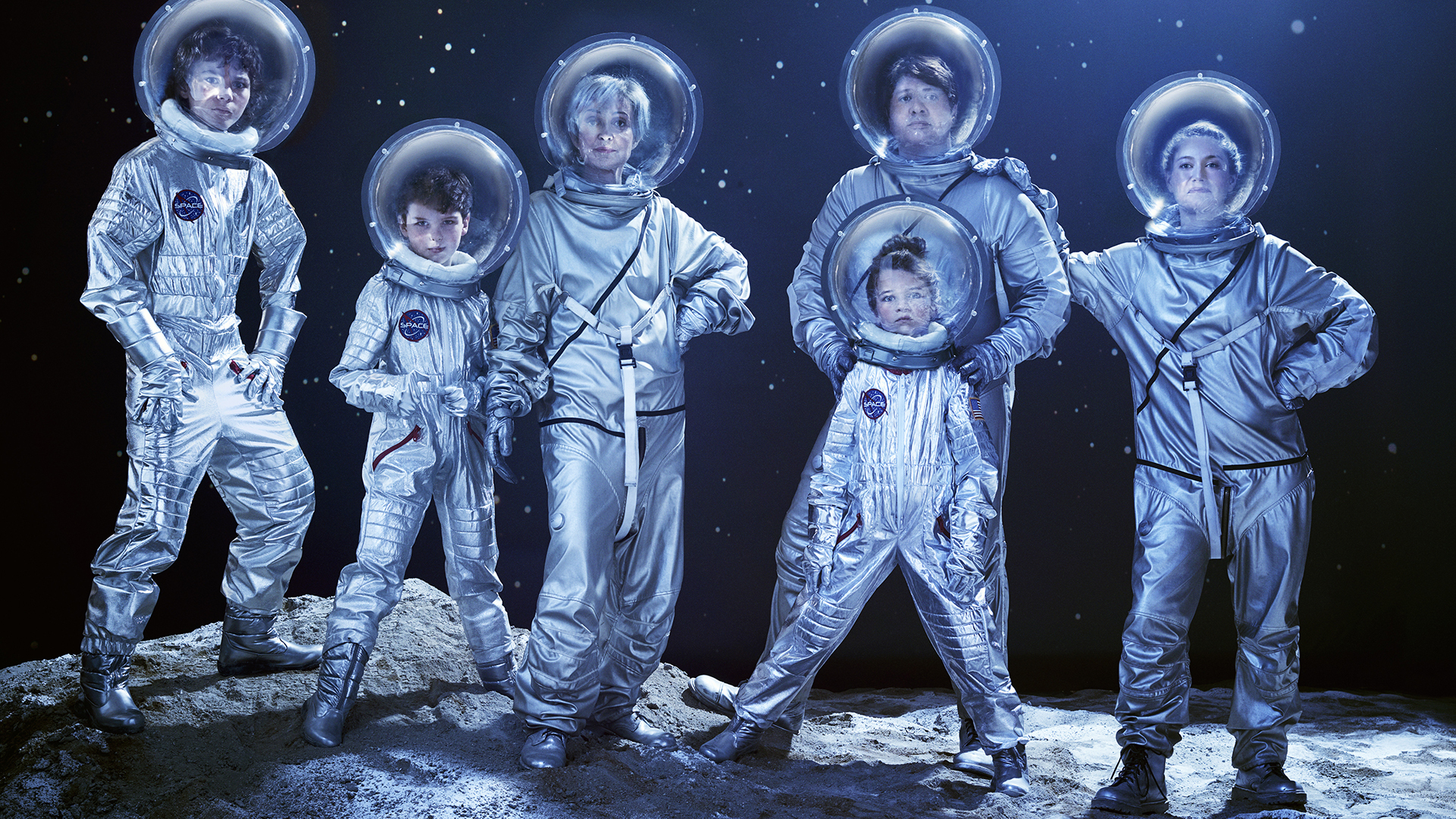 The cast of Young Sheldon as American astronauts